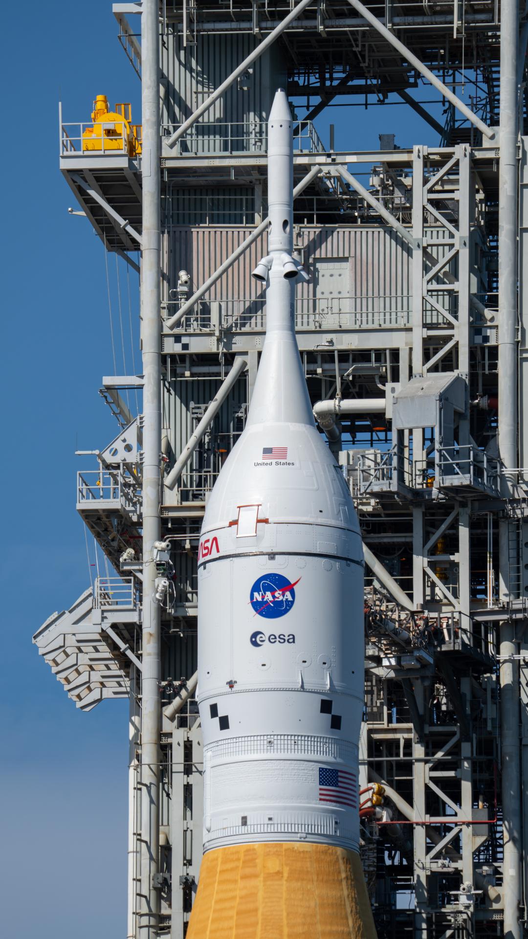 This image shows NASA’s SLS (Space Launch System) and Orion spacecraft rolling out of the Vehicle Assembly Building at NASA’s Kennedy Space Center. NASA's massive Crawler-Transporter, upgraded for the Artemis program, carries the powerful SLS rocket and Orion spacecraft on the Mobile Launcher from the Vehicle Assembly Building to Launch Pad 39B at Kennedy Space Center in preparation for the Artemis II mission.